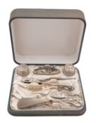 An early 20th century American Art Nouveau silver lady's dressing table set, stamped Sterling,