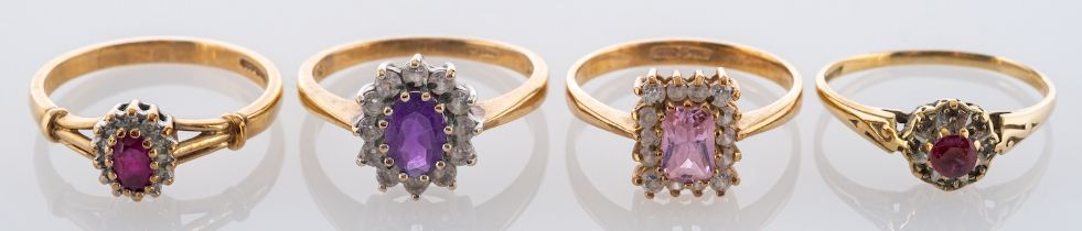 Four gemset cluster rings, including two 9ct gold, ruby rings, a 9ct gold,