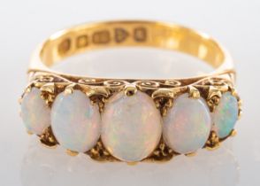 An Edwardian, 18ct gold, cabochon-cut opal, five-stone ring, length of ring head ca.