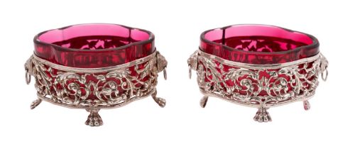 A pair of early 20th French Republic silver and glass salts, marks indistinct, of lobbed form,