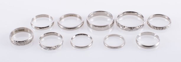 A group of ten platinum wedding bands, five pain and five with engraved decoration,