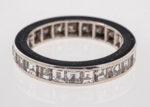 WITHDRAWN LOT A diamond eternity ring, set with square cut diamonds, approximately 1 carat total,
