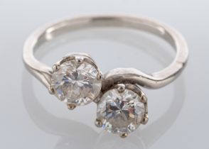 A diamond two stone ring, set with two brilliant cut diamonds, approximately 1.