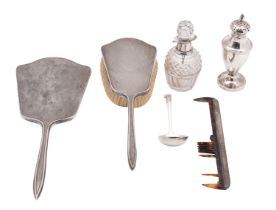 A small group of silver to include: a silver and glass condiment pot, a vase shaped caster,