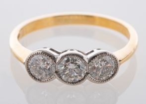 An 18ct gold, round, brilliant-cut diamond, three-stone ring, total estimated diamond weight ca.