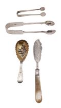 A Victorian silver caddy spoon, Thomas Hart Stone, Exeter, 1871, with embossed gilded bow,