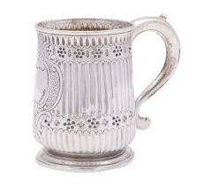 A George II silver mug, maker's mark rubbed, London 1744 with later embossed decoration,