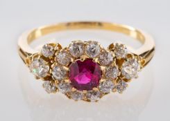 A cushion-cut ruby and old-cut diamond cluster ring, estimated ruby weight ca. 0.