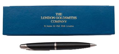 A Dunhill ball pen, with carbon effect finish and stainless steel fittings,