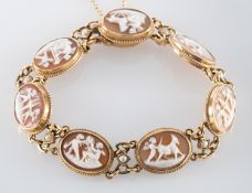 A 9ct gold bracelet of oval shell cameo plaques, depicting putti, with seed pearl set spacers,
