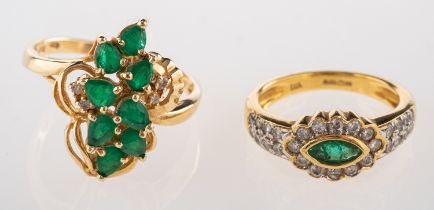 A 14ct emerald and diamond cluster ring, set with pear shaped emeralds and brilliant cut diamonds,