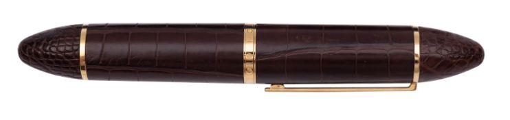A Louis Vuitton Cargo Exotic brown leather fountain pen, gilt clip and fittings,