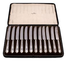 A set of twelve unmarked handled dessert knives, maker Walker & Hall,
