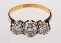 A diamond three stone ring, set with three old brilliant cut diamonds, approximately 1.