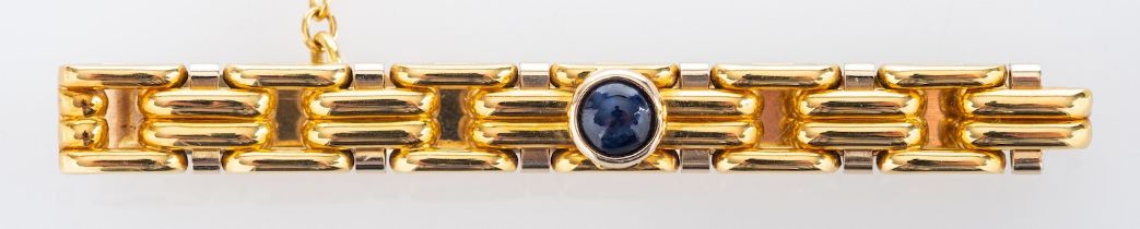 A synthetic sapphire tie clip,