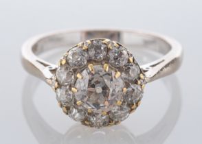 A diamond cluster ring, the central old brilliant cut diamond, estimated to weigh 0.