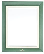 A Rolex green leather countertop advertising mirror,