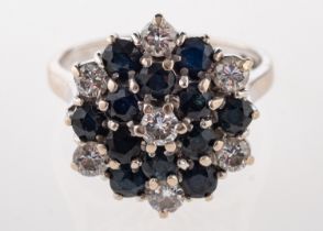 An 18ct gold, sapphire and diamond cluster ring,
