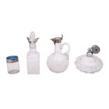 A group of silver and glass bottles, comprising a German silver claret jug, maker ELIMEYER,