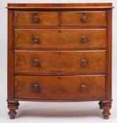 A Victorian mahogany bow fronted chest, with raised top,