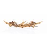 An Edwardian 9ct. Gold Bar Brooch, with floral design and a swallow bird to the centre.