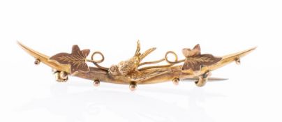 An Edwardian 9ct. Gold Bar Brooch, with floral design and a swallow bird to the centre.