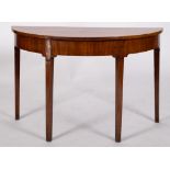 An early George III mahogany demi-lune table, circa 1770; previously one end of a dining table,