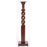 A Victorian mahogany jardiniere stand, adapted from a bed post,