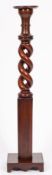 A Victorian mahogany jardiniere stand, adapted from a bed post,