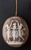 A shell cameo brooch, depicting The Three Graces, stamped '9CT', total length ca.