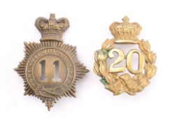 20th Regiment of Foot (East Devon) Glengarry badge, with Queen's crown over laurel wreath,