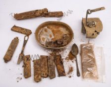A small collection of excavated and salvaged militaria, including empty gun clips,