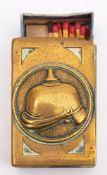 A WWI German brass match box, the obverse with embossed picklehaube in a circular cartouche,