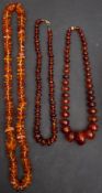 Three amber bead necklaces, including a necklace with amber beads of yellowish orange hue,
