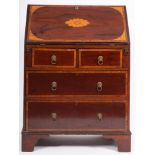 An Edwardian mahogany and inlaid bureau, crossbanded in kingwood, bordered with boxwood lines,