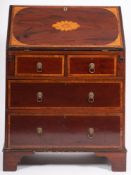 An Edwardian mahogany and inlaid bureau, crossbanded in kingwood, bordered with boxwood lines,