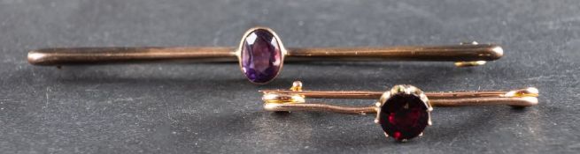 Two gemset bar brooches; including an amethyst brooch, stamped '9CT', and a 9ct gold,