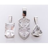 A Platinum Danburite Pendant, the rectangular stone claw set, and Two Platinum White Topaz Pendants,