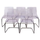 A set of five clear plastic chairs, by I