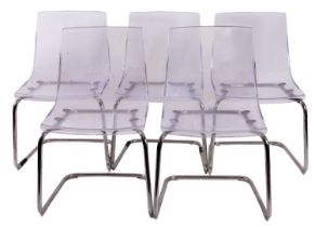 A set of five clear plastic chairs, by I