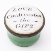 An early 19th century circular enamel patch box 'Love Continues the Gift',