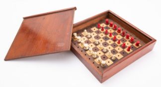 A mahogany cased stained bone travelling chess set, the case 17 x 3.