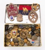 A collection of various Regimental buttons, together with a silver ARP badge a WVS cloth patch etc.