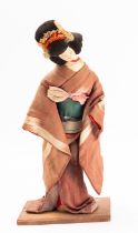 A Post-War linen doll of a geisha, reputedly made from medal ribbons,