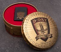 A Zippo 'D-Day' 50th Anniversary Limited edition lighter in original tin.
