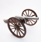 A 20th century 1/10th scale model of a Napoleonic 12 pound cannon.