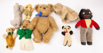 Two blonde plush Teddy bears, together with a collection of various other figures.