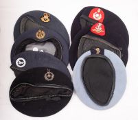A group of seven various berets, including RAF,