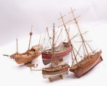 A group of four model boats,