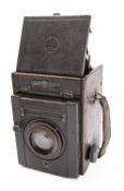 A Thompson Pickard 'Junior Special' camera, with glass slides, in its original case, circa 1926.